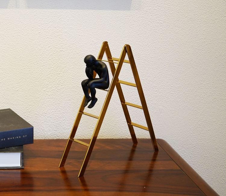 Black Human on a Staircase Figurine