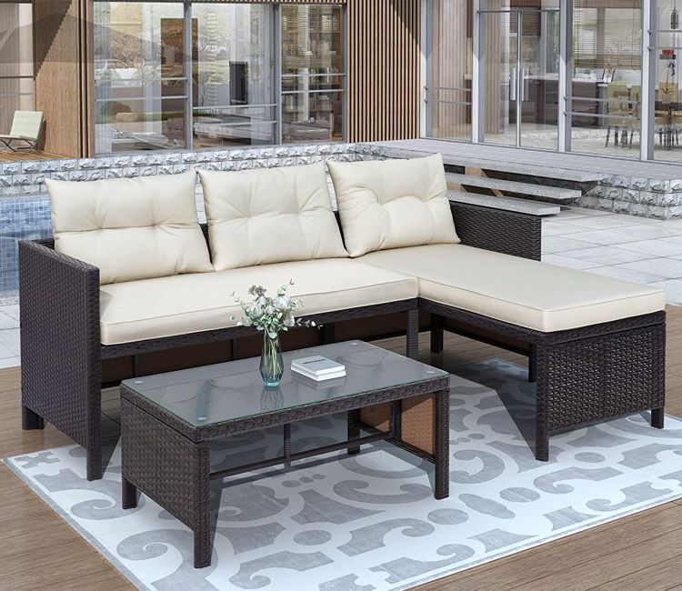 Black Rattan And Wicker Outdoor Furniture Set With Cream Cushions And Table