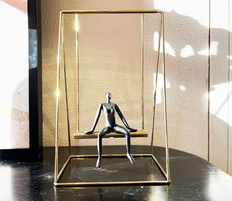 Human on a Golden Swing Figurine (S, Black)