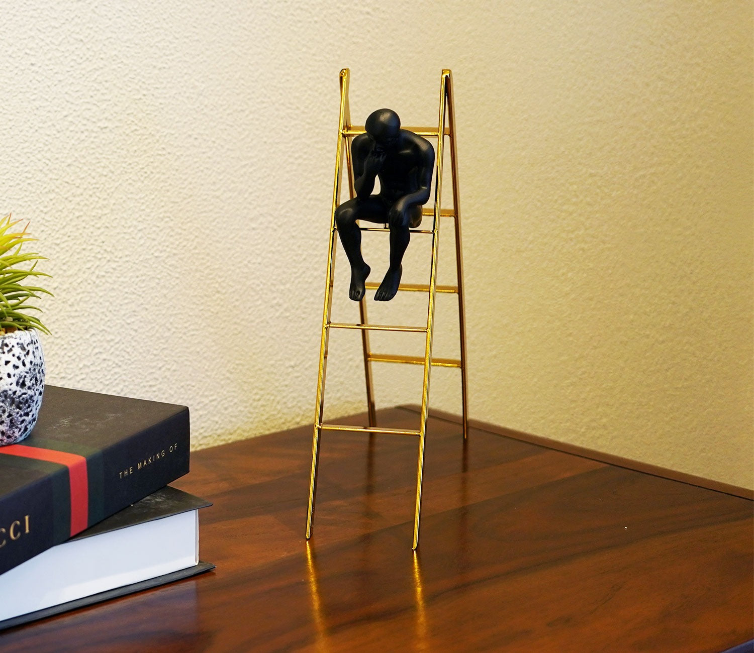 Black Human on a Staircase Figurine