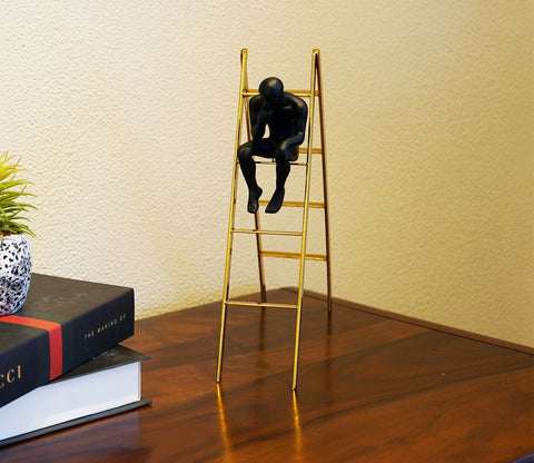 Black Human on a Staircase Figurine