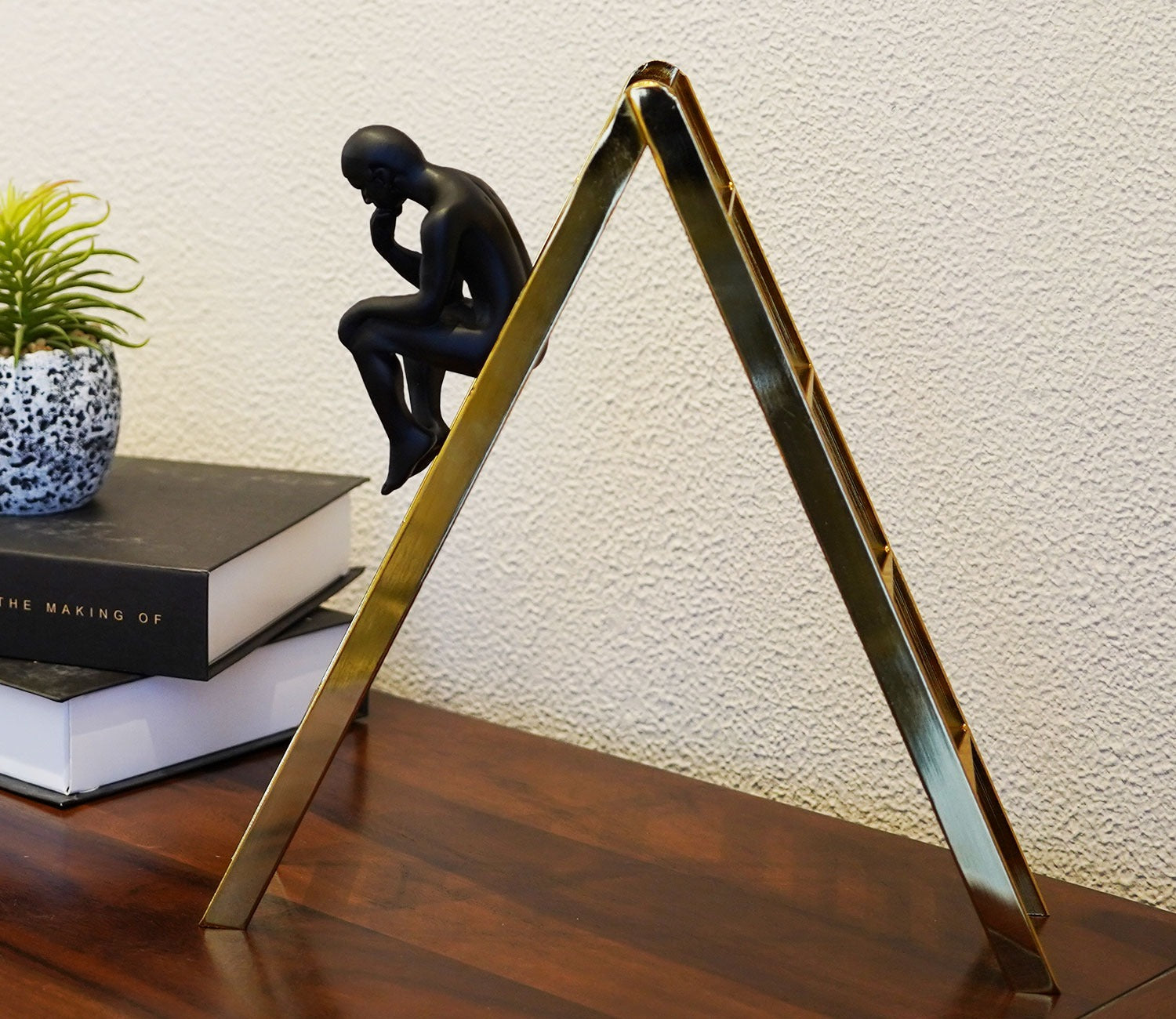 Black Human on a Staircase Figurine