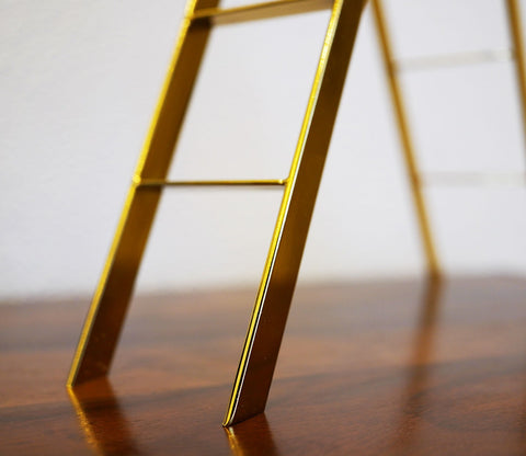 Black Human on a Staircase Figurine